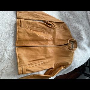 Beautiful mock neck leather coat with great snap detail at the hip